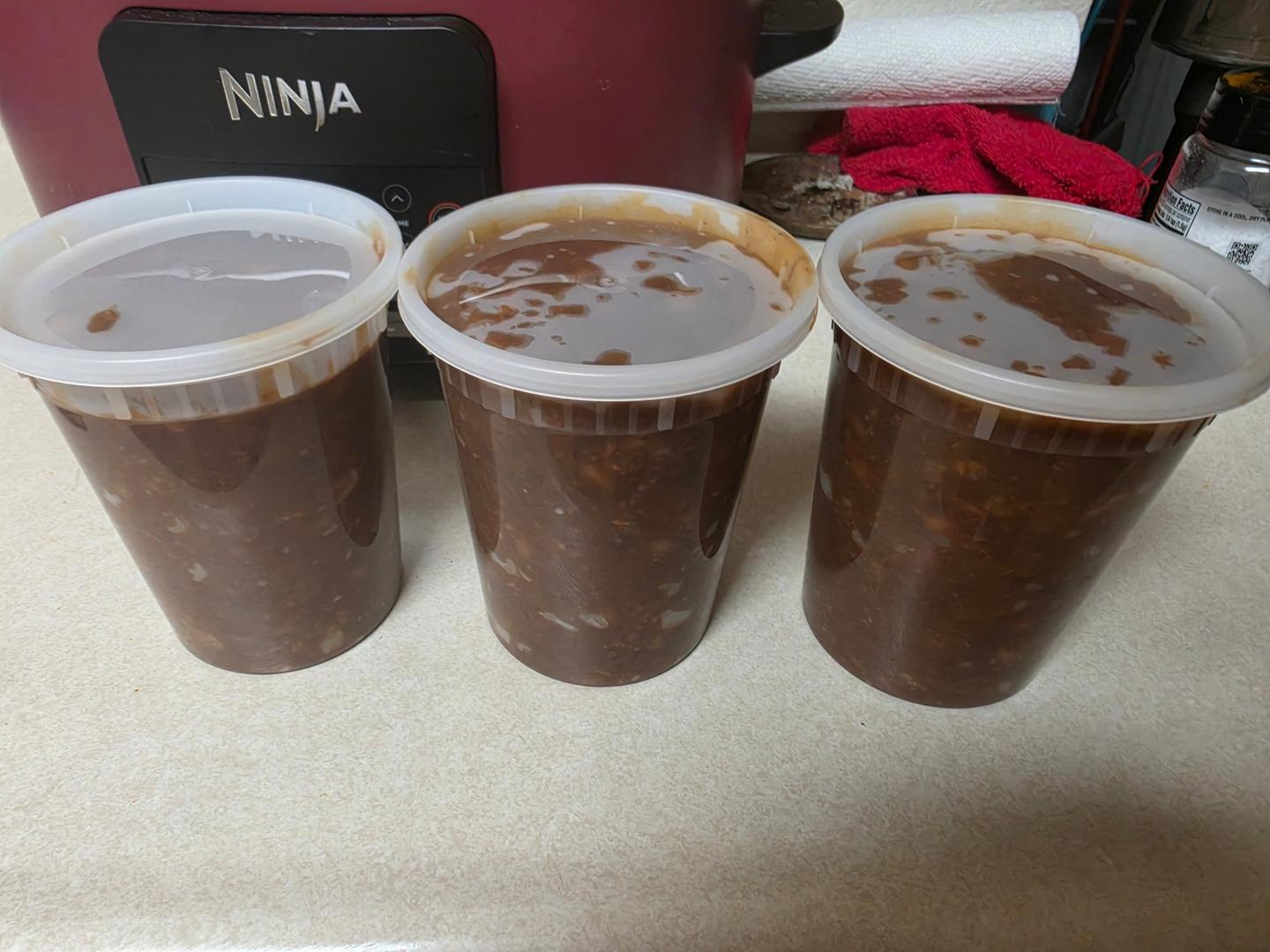 The chili packed up in three quart containers